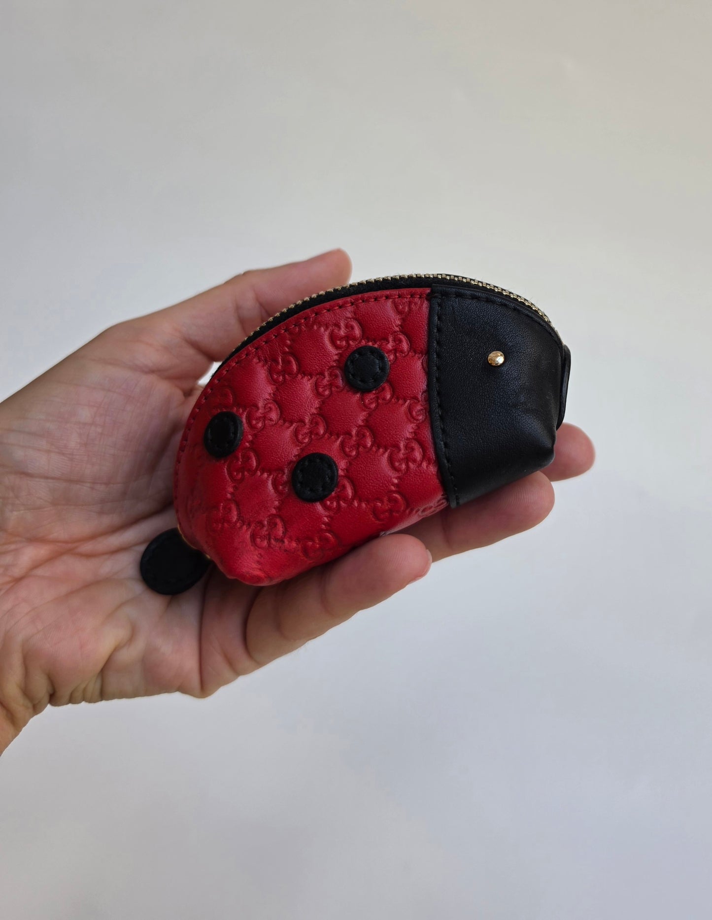 Portamonete Gucci coccinella in pelle microguccissima
