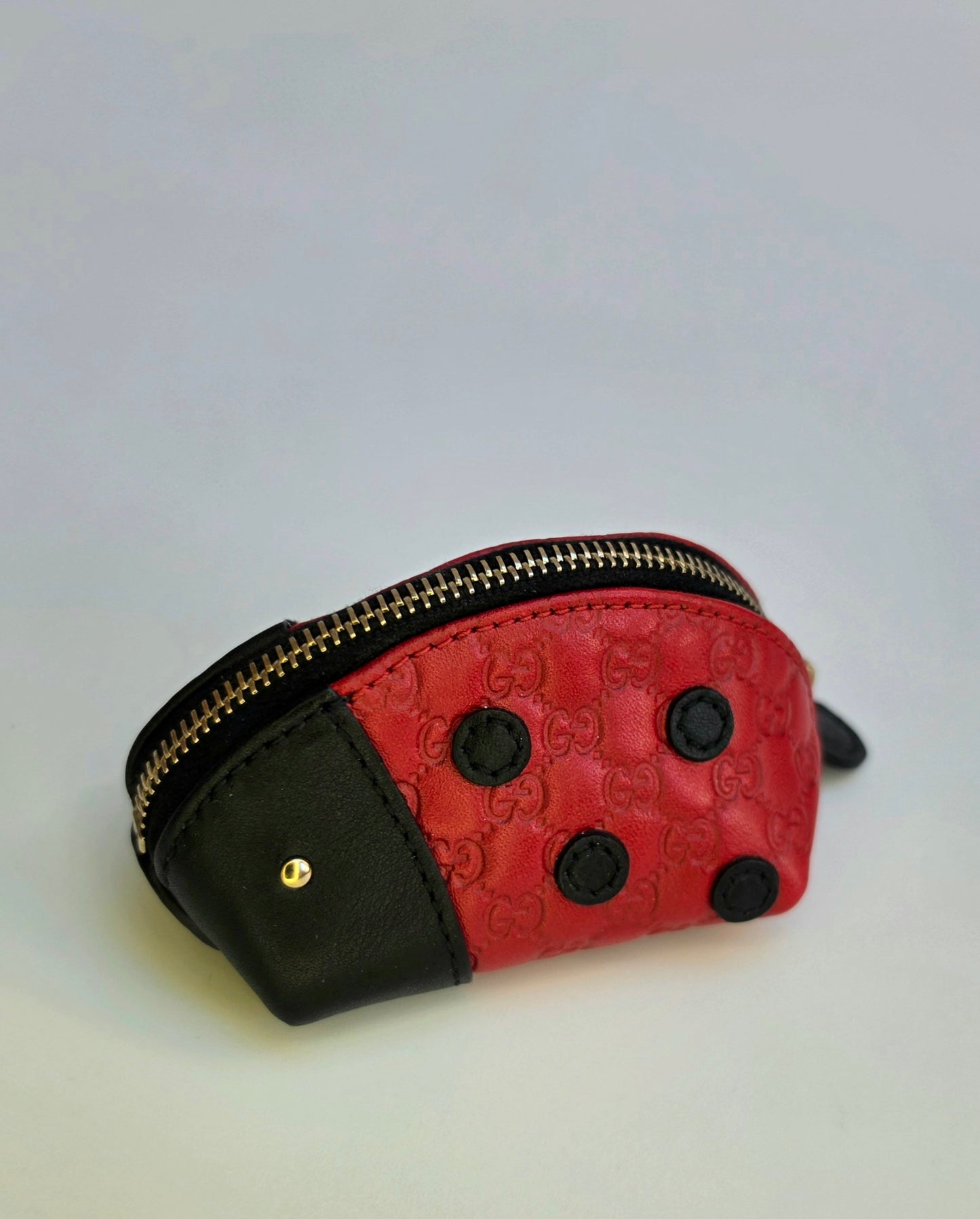 Portamonete Gucci coccinella in pelle microguccissima