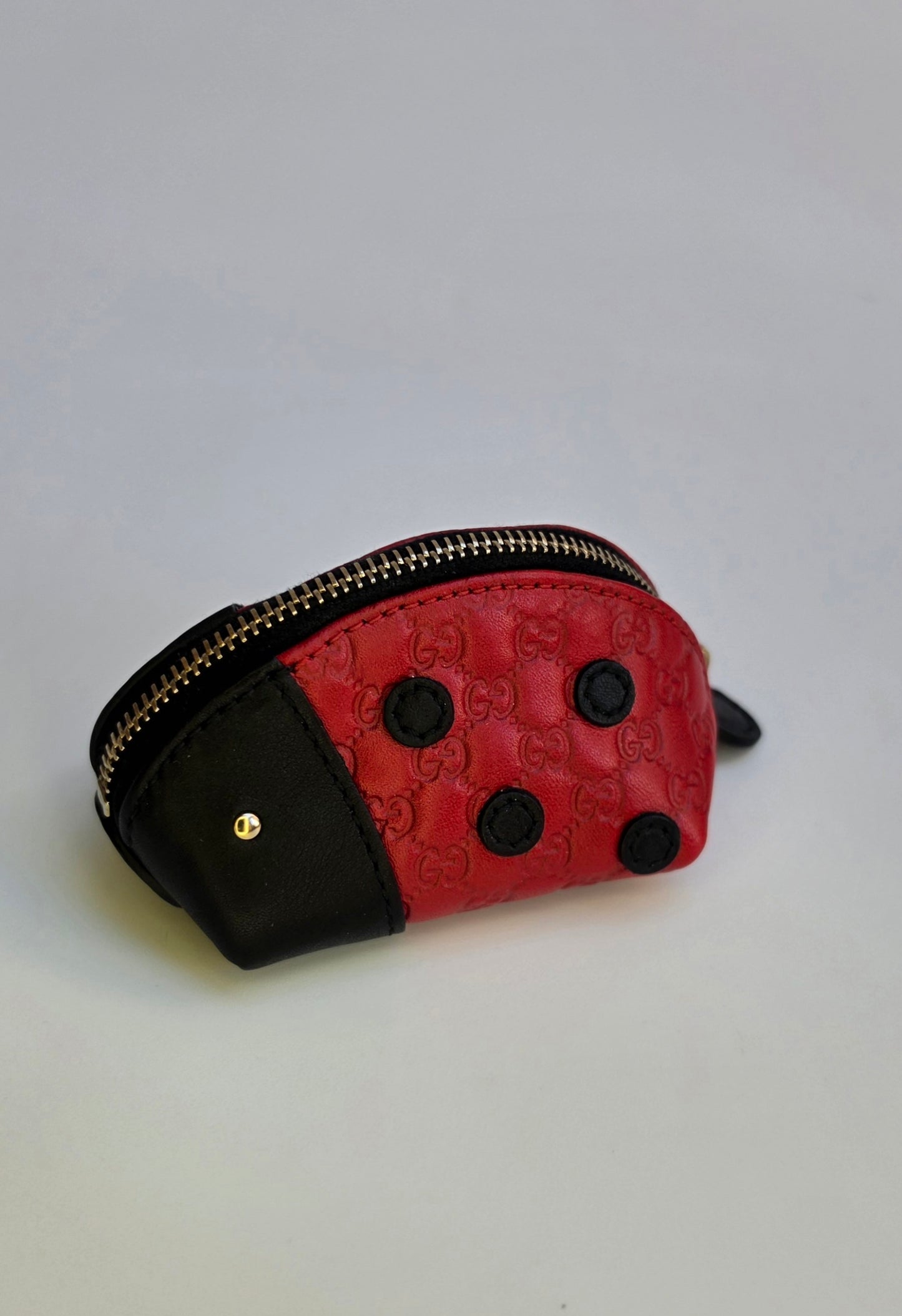 Portamonete Gucci coccinella in pelle microguccissima