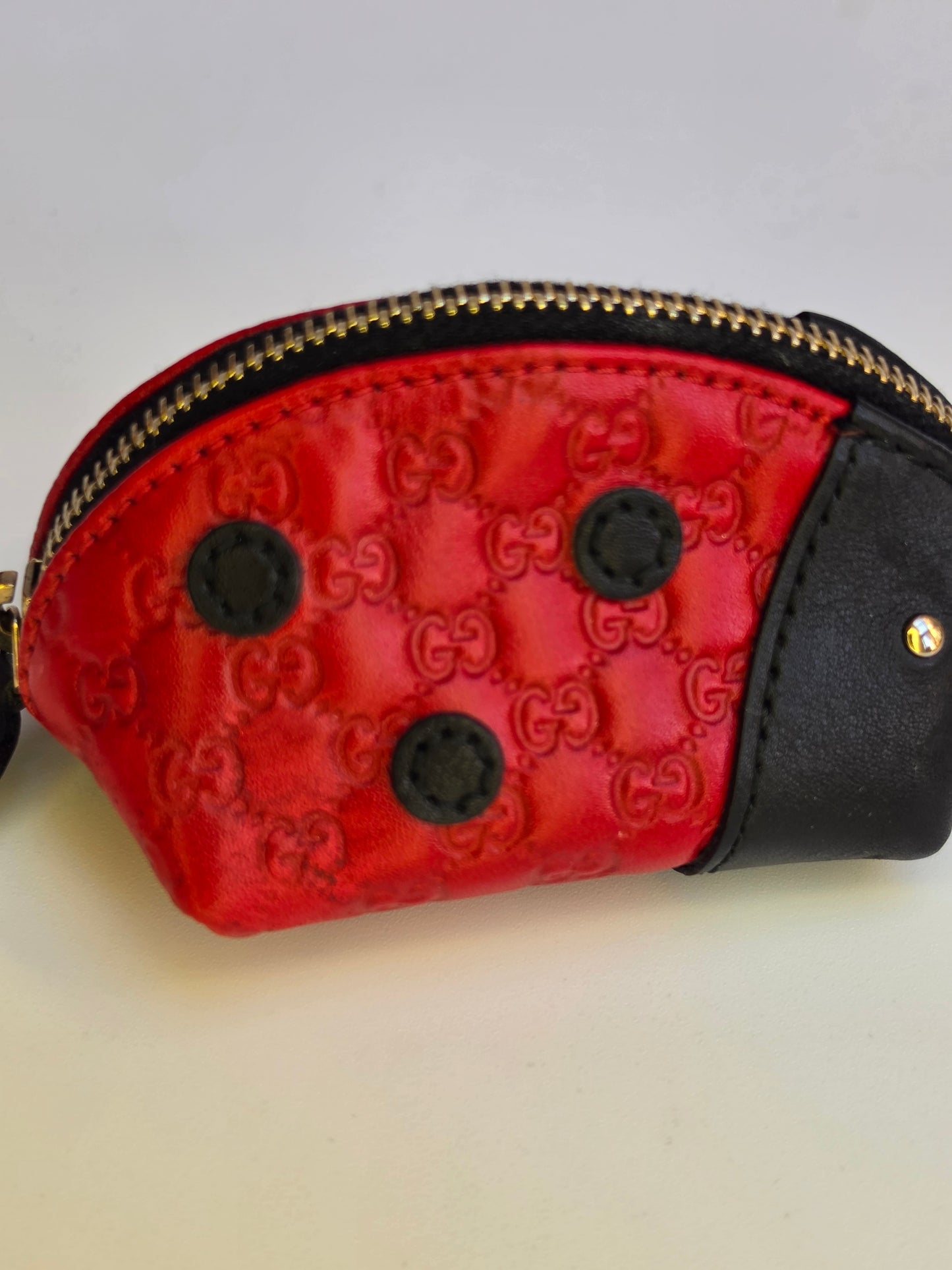 Portamonete Gucci coccinella in pelle microguccissima