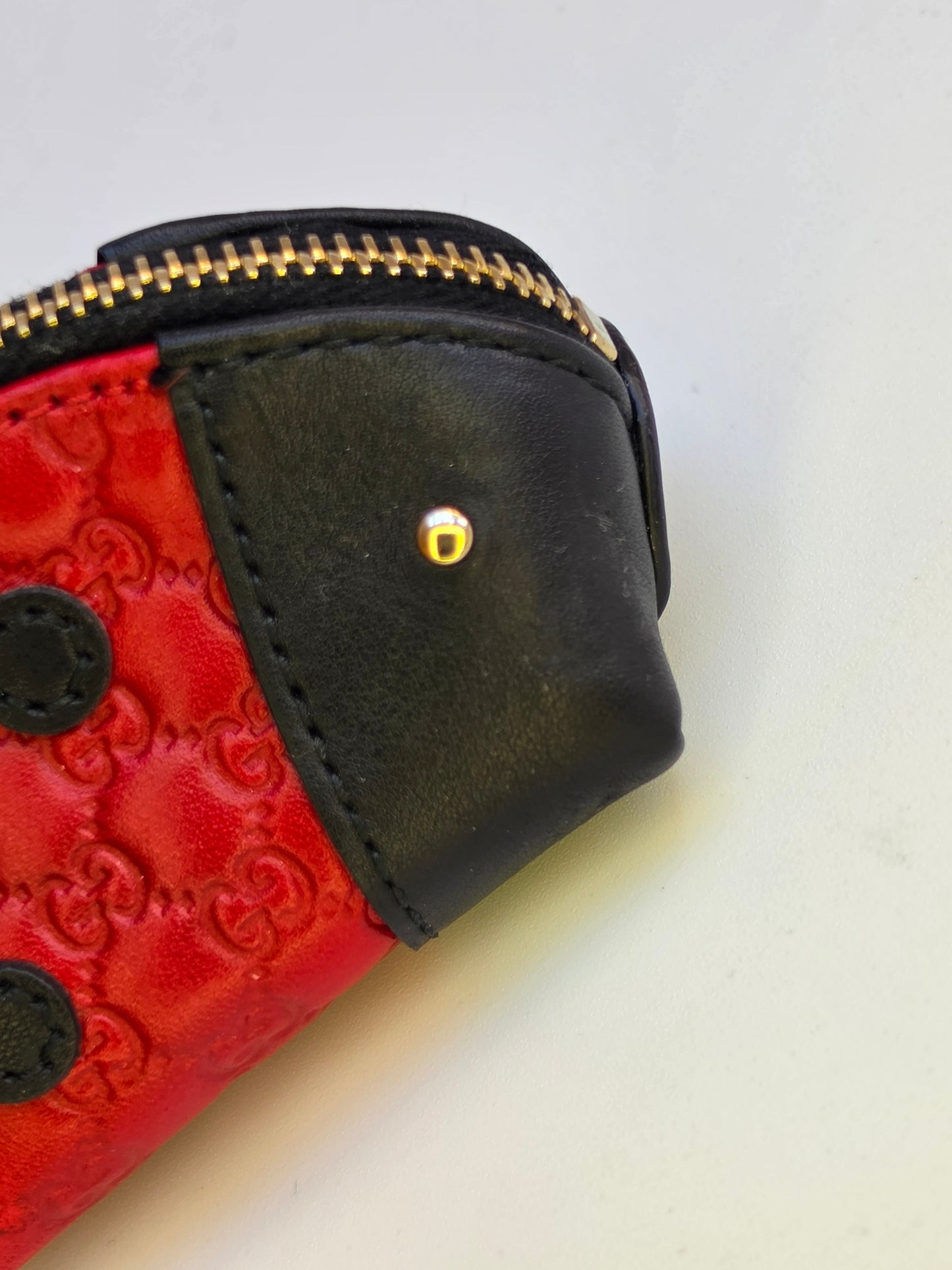 Portamonete Gucci coccinella in pelle microguccissima