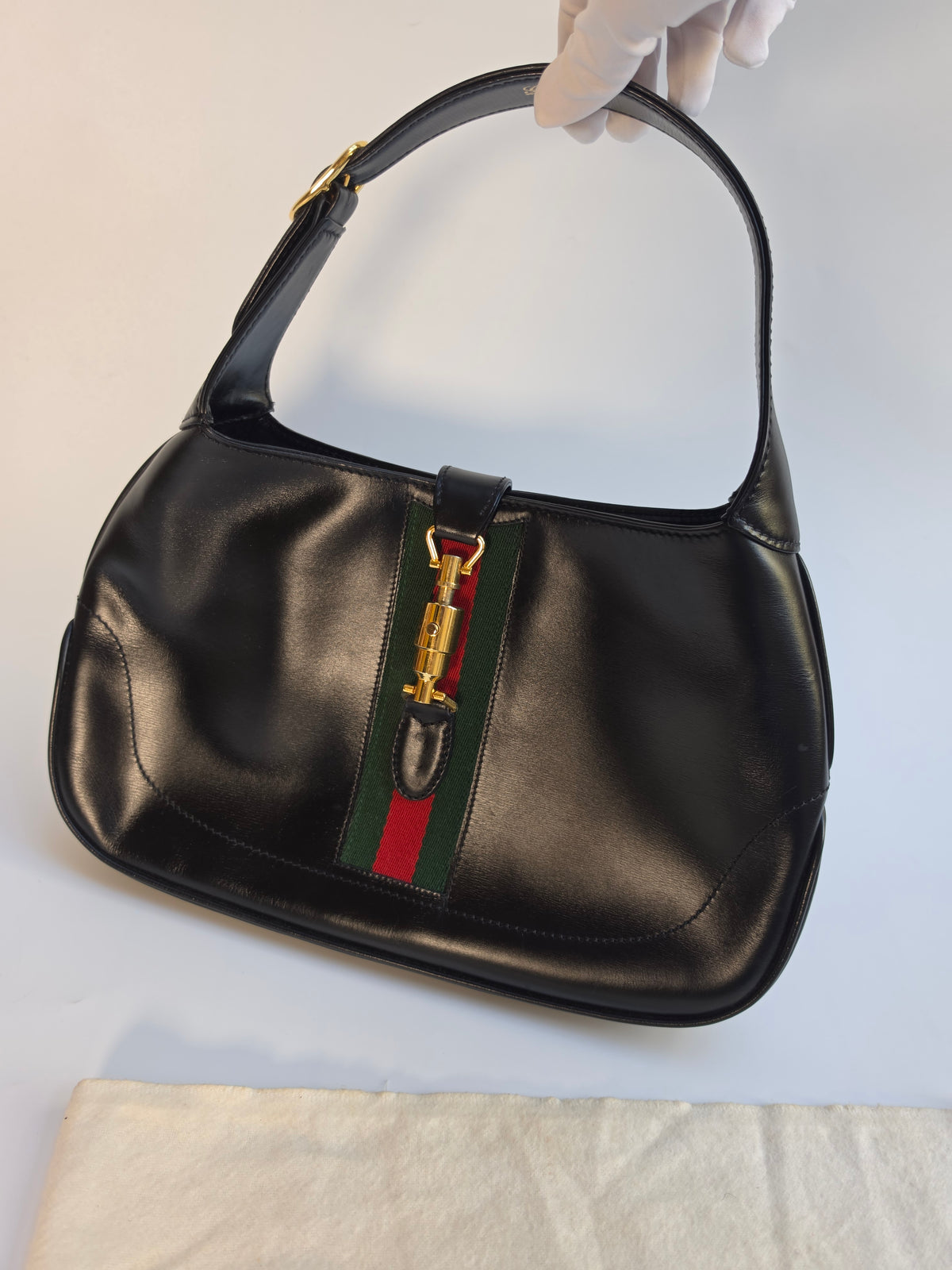 Vintage Gucci Jackie bag in black leather with green-red-green web stripe, 1970s