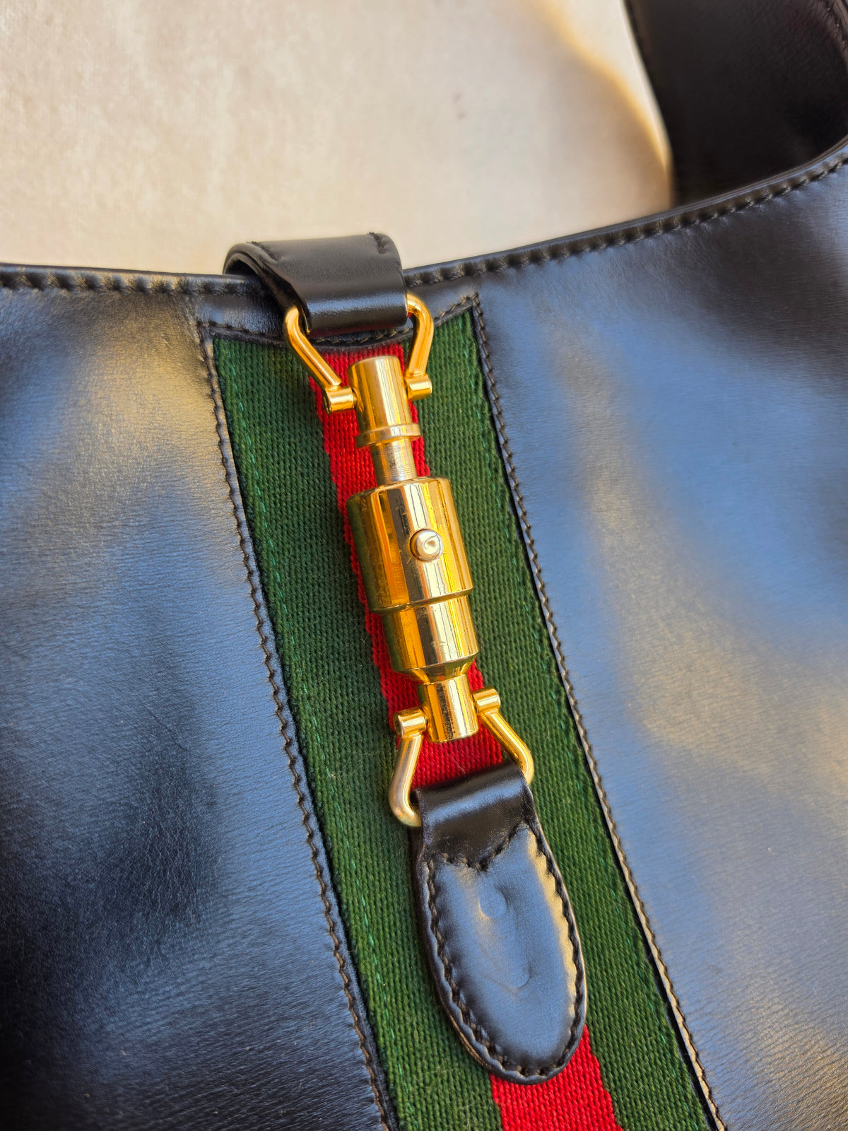 Vintage Gucci Jackie bag in black leather with green-red-green web stripe, 1970s