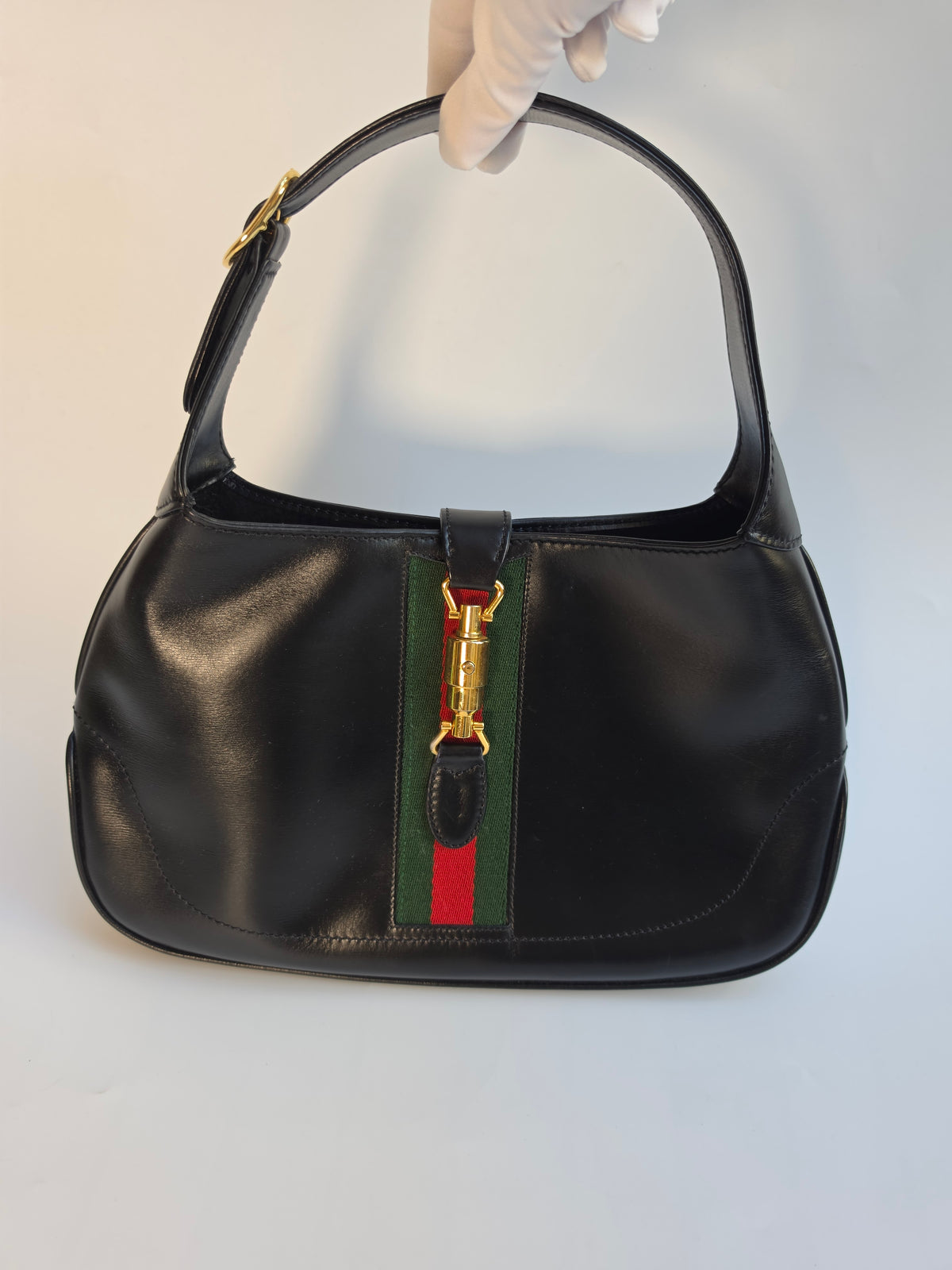 Vintage Gucci Jackie bag in black leather with green-red-green web stripe, 1970s